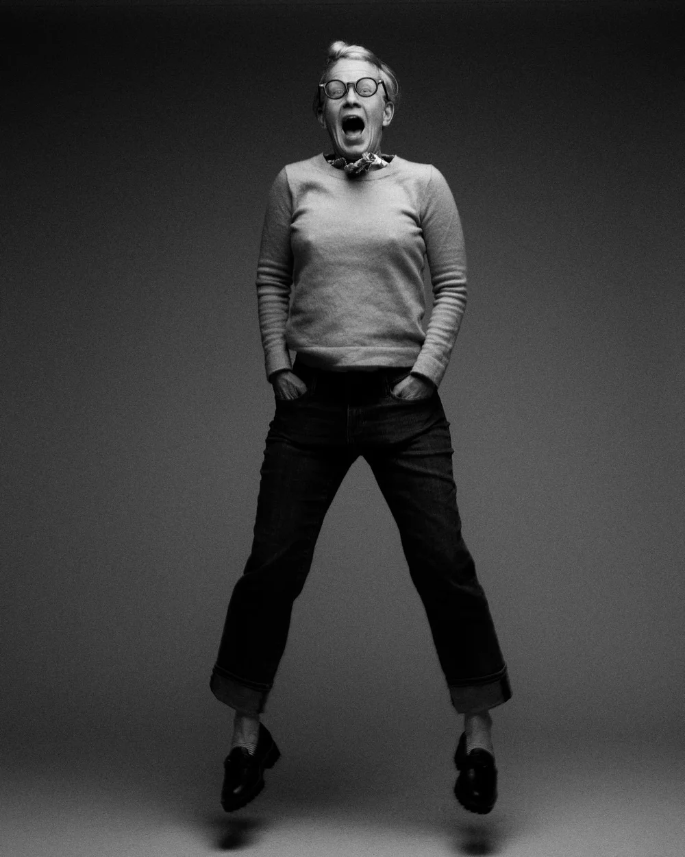 Ewa Marie Long, founder of AWE Aesthetics, mid-jump